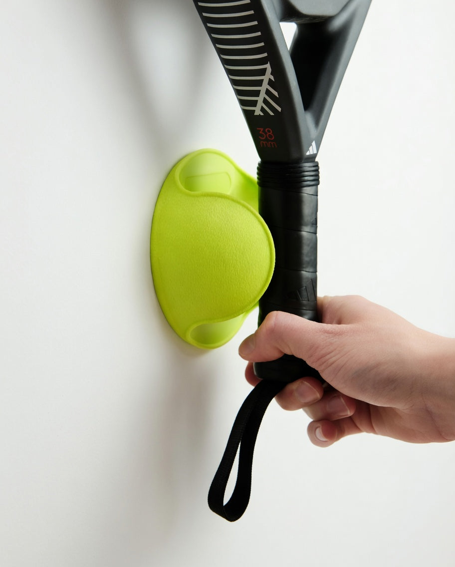 Inserting Racket into Padel Racket Wall Mount